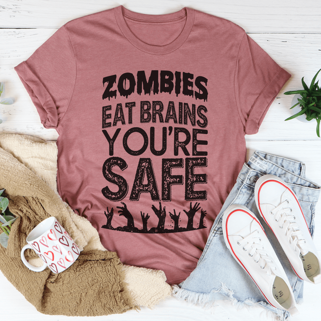 Zombies Eat Brains You're Safe T-Shirt displayed on a mannequin, featuring a humorous zombie-themed graphic.