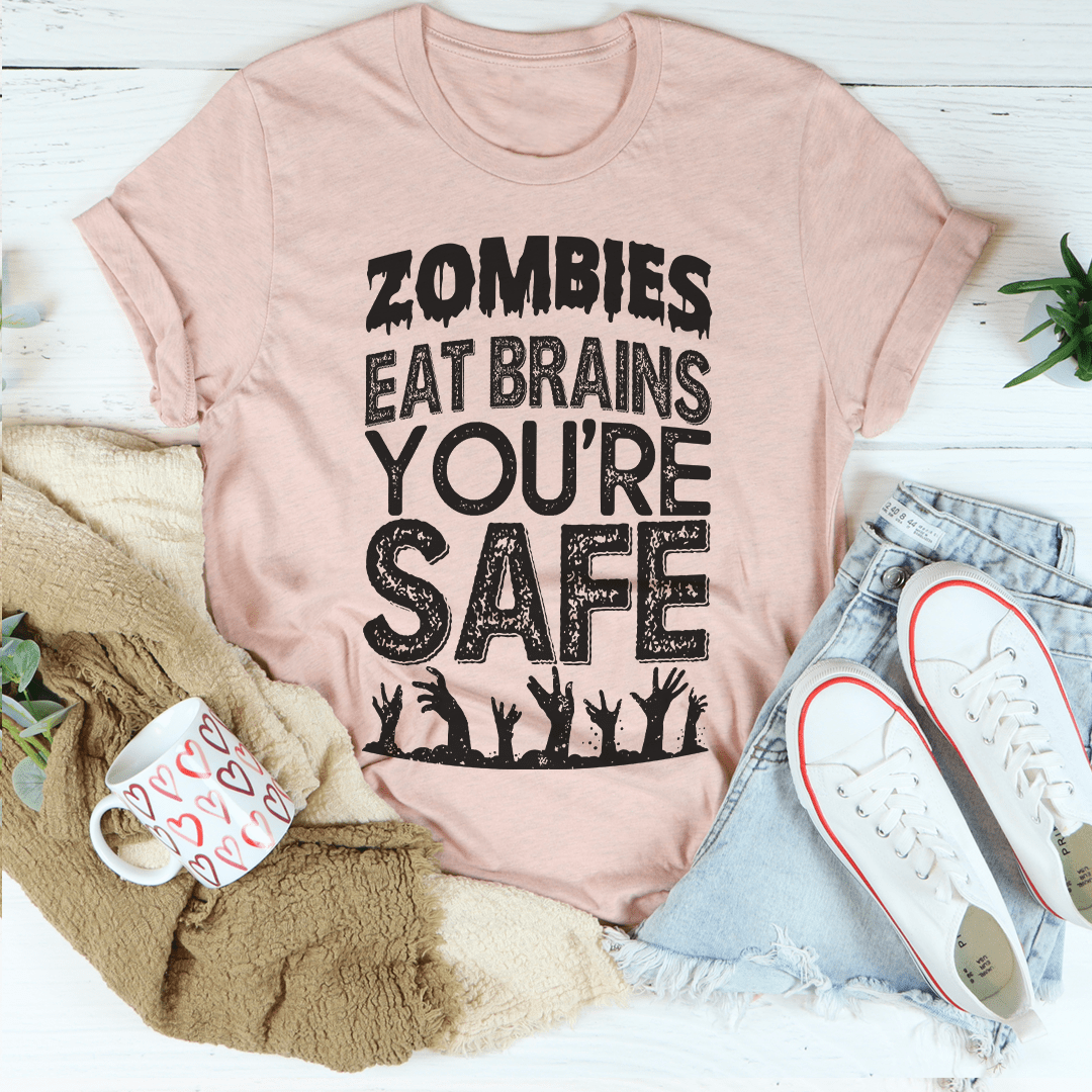 Zombies Eat Brains You're Safe T-Shirt displayed on a mannequin, featuring a humorous zombie-themed graphic.