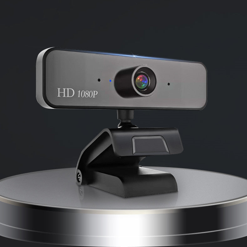 1080P HD Video Camera with built-in microphone, showcasing its sleek design and compact size.