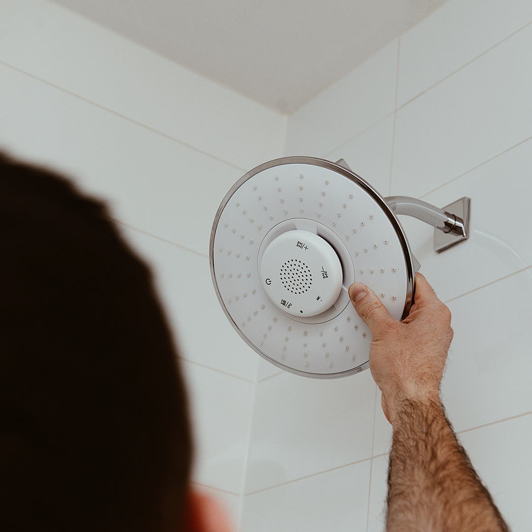 Bluetooth Speaker Shower Head with detachable touchscreen speaker, showcasing modern design and functionality.