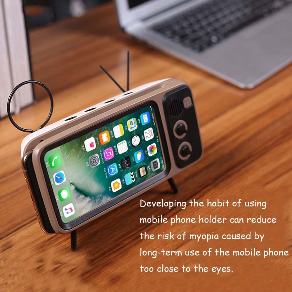 Retro TV design Bluetooth speaker with phone holder, compact and stylish for modern audio needs.