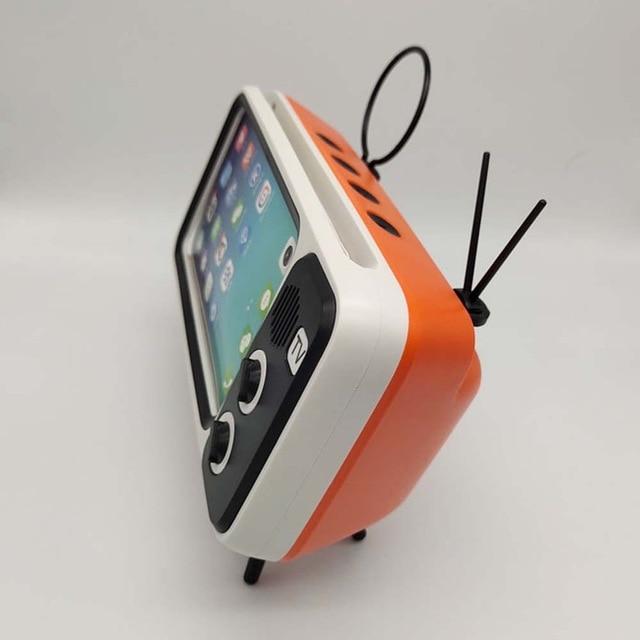 Retro TV design Bluetooth speaker with phone holder, compact and stylish for modern audio needs.