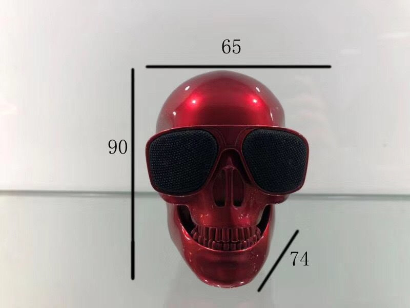 Wireless Bluetooth Speaker in the shape of a cartoon bone ghost head, featuring a playful design and compact size.