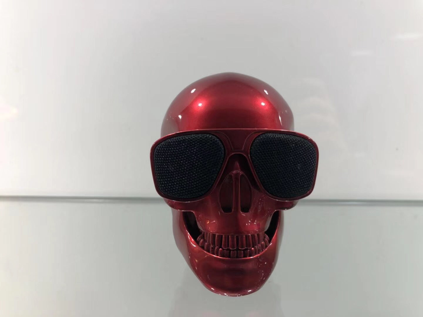 Wireless Bluetooth Speaker in the shape of a cartoon bone ghost head, featuring a playful design and compact size.