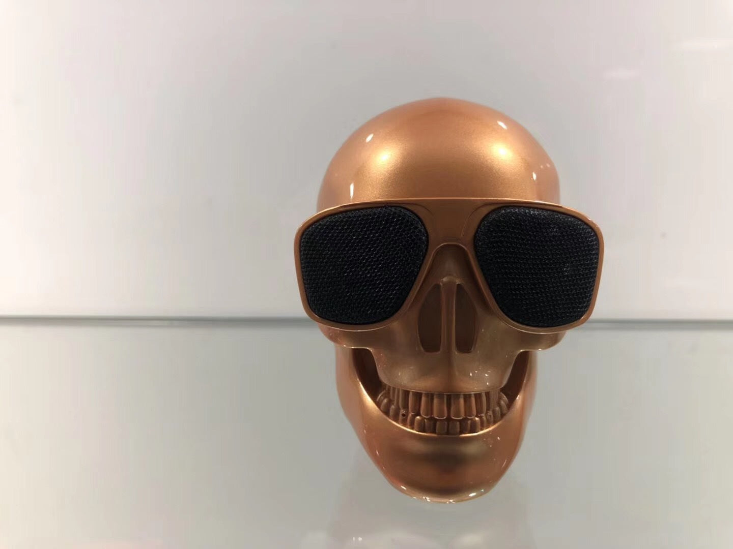 Wireless Bluetooth Speaker in the shape of a cartoon bone ghost head, featuring a playful design and compact size.