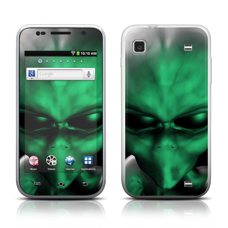 Smartphones with green alien wallpaper.