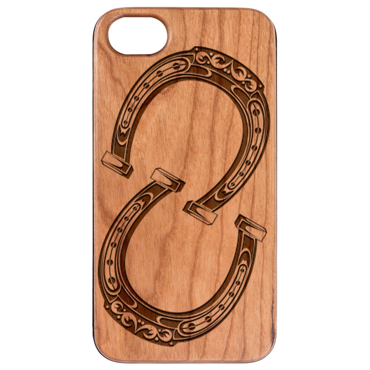 Engraved horse shoes showcasing intricate designs, crafted from durable wood, perfect for equestrian decor.