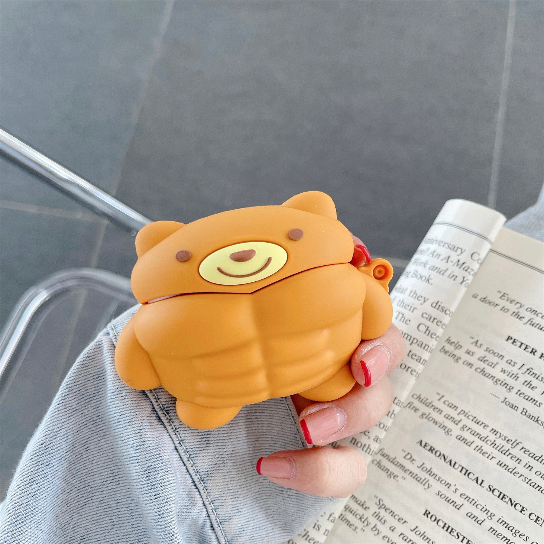 Muscle Bear Cartoon Silicone Earphone Case in vibrant colors featuring a cute bear design, perfect for AirPods protection.