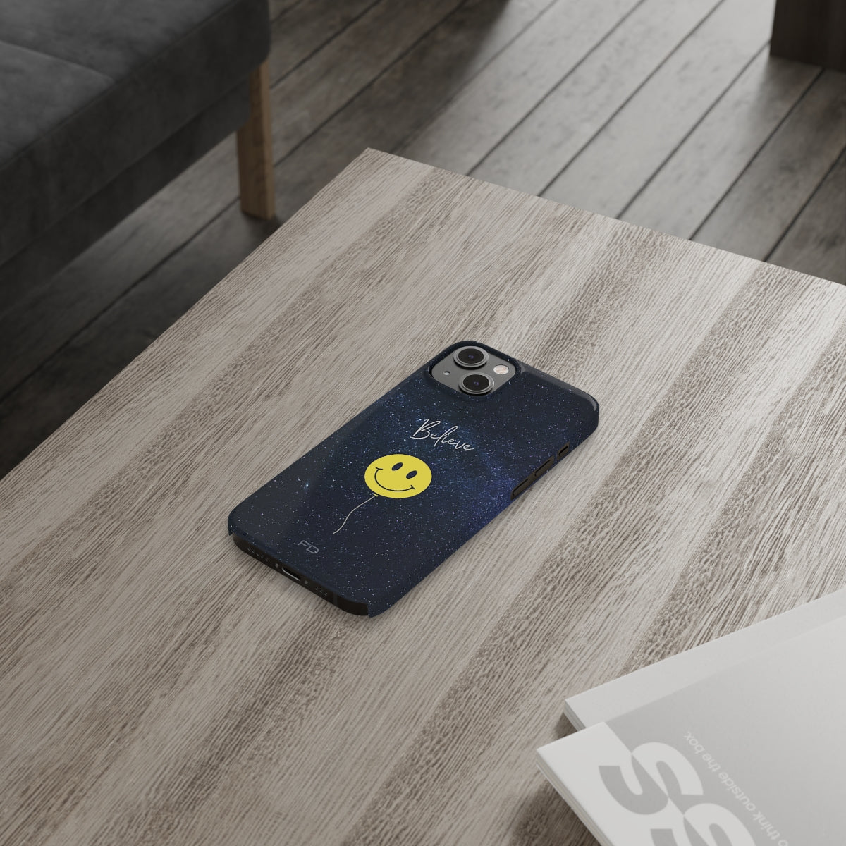 Smiley Face in Space Believe Slim Case for iPhone 14, featuring a glossy finish and a fun cosmic design.