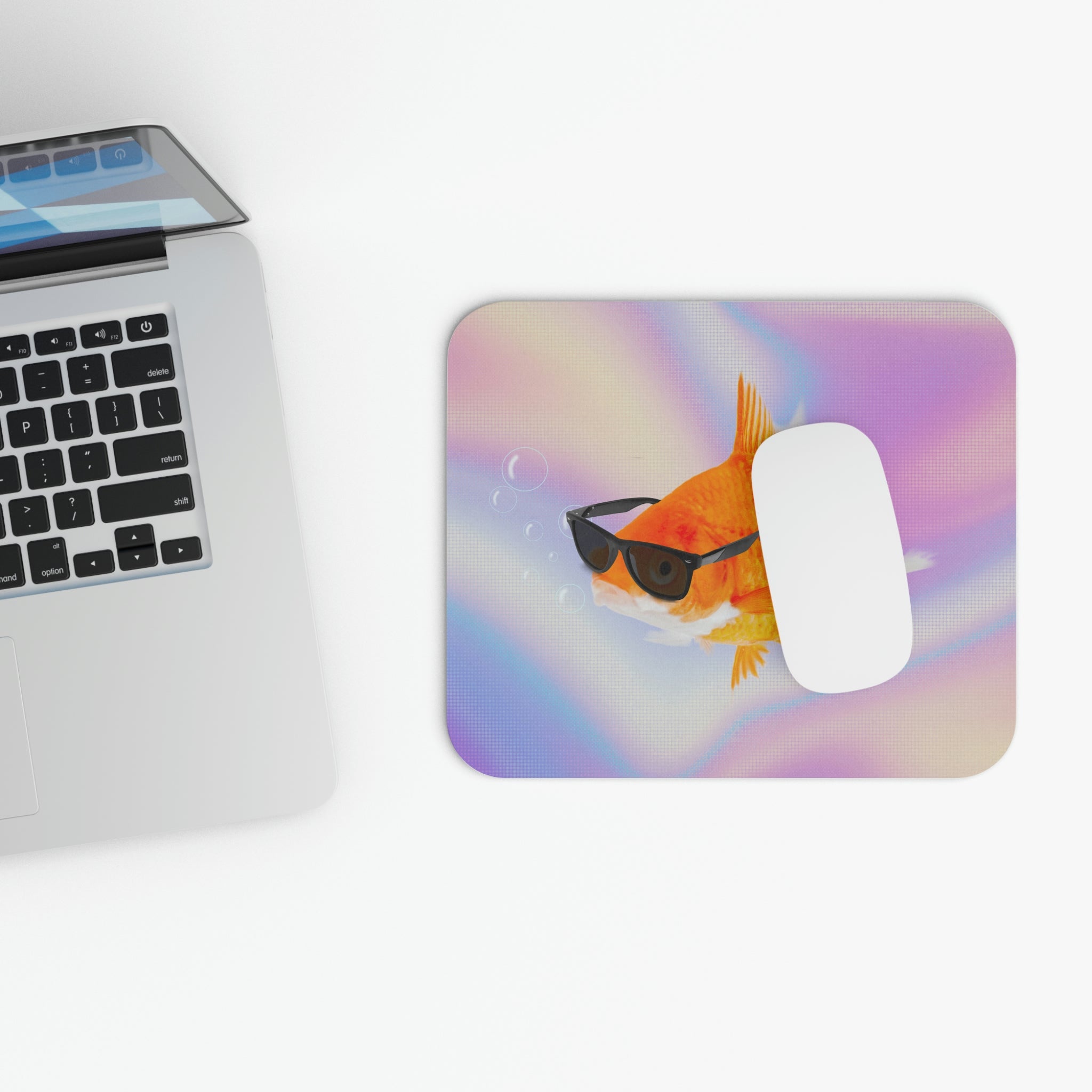 A colorful mouse pad featuring a gold fish wearing sunglasses, designed for smooth mouse movement and a strong grip.