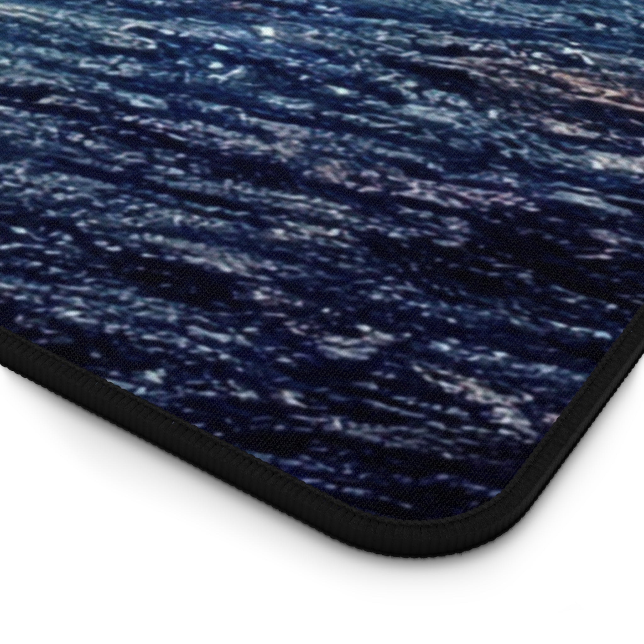 Still Earth Desk Mat featuring a sleek design, 4mm thick neoprene material, anti-slip backing, and hemmed edges, measuring 31" x 15.5".