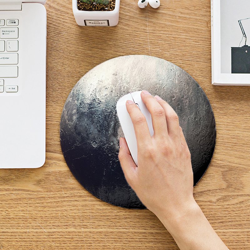 The Pluto Mouse Pad featuring a silky smooth surface and anti-slip rubber base, designed for optimal mouse performance and comfort.