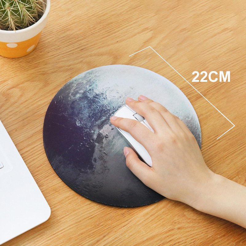 The Pluto Mouse Pad featuring a silky smooth surface and anti-slip rubber base, designed for optimal mouse performance and comfort.