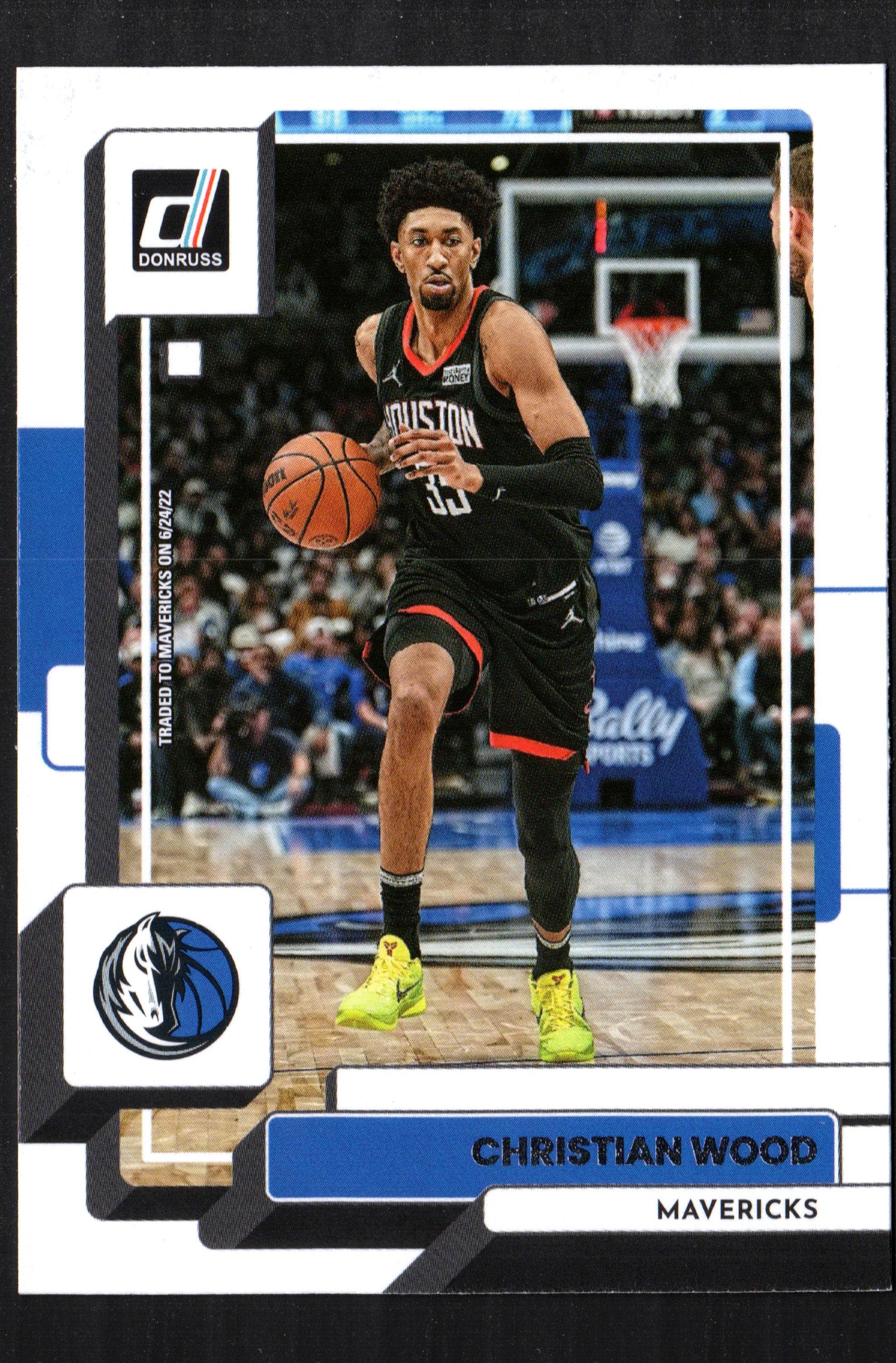 Christian Wood Dallas Mavericks #145 trading card from the 2022-23 Donruss set, featuring vibrant imagery and player details.