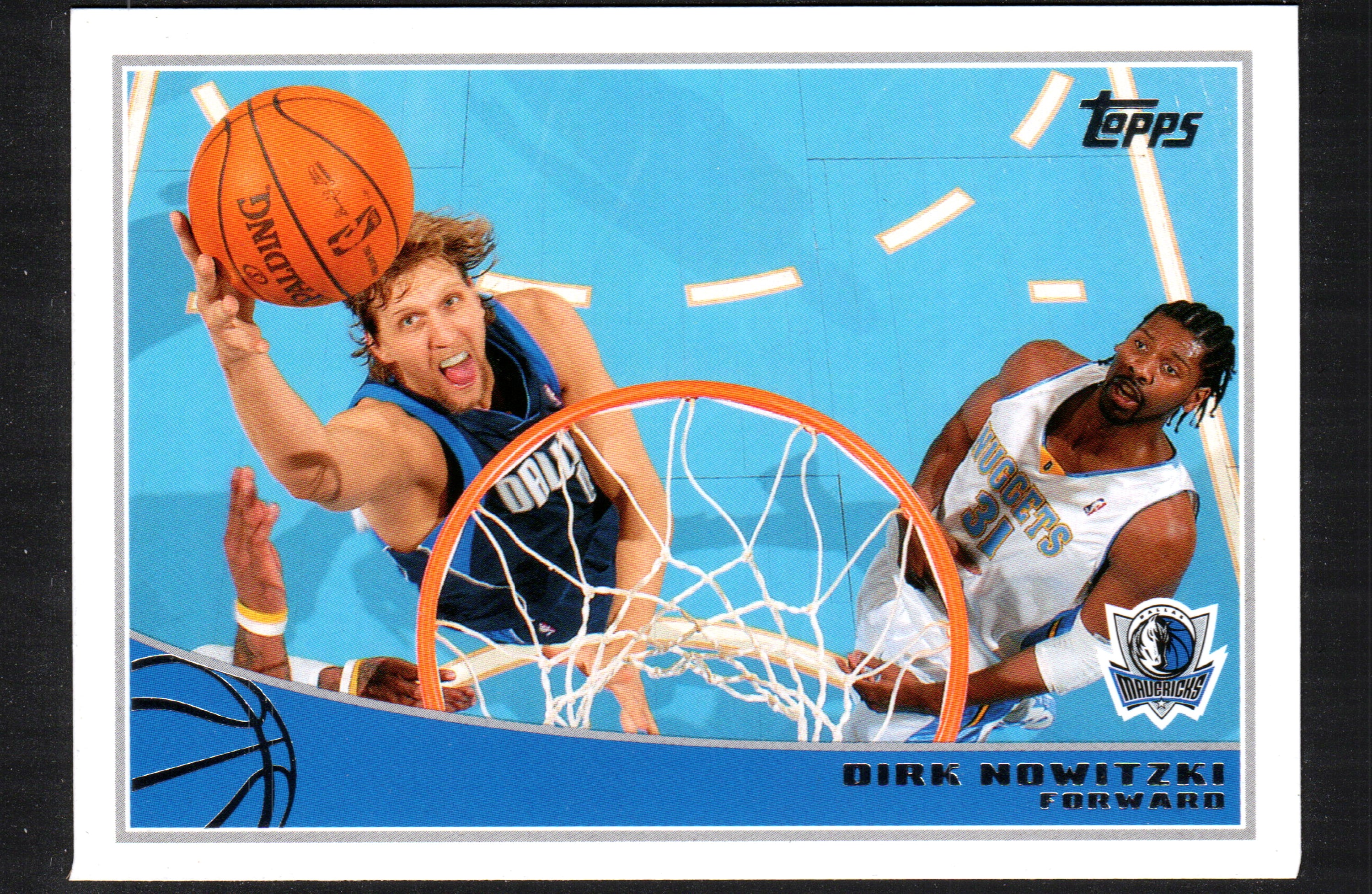 Dirk Nowitzki Dallas Mavericks #52 trading card from 2009 Topps, featuring the NBA star in his team uniform.