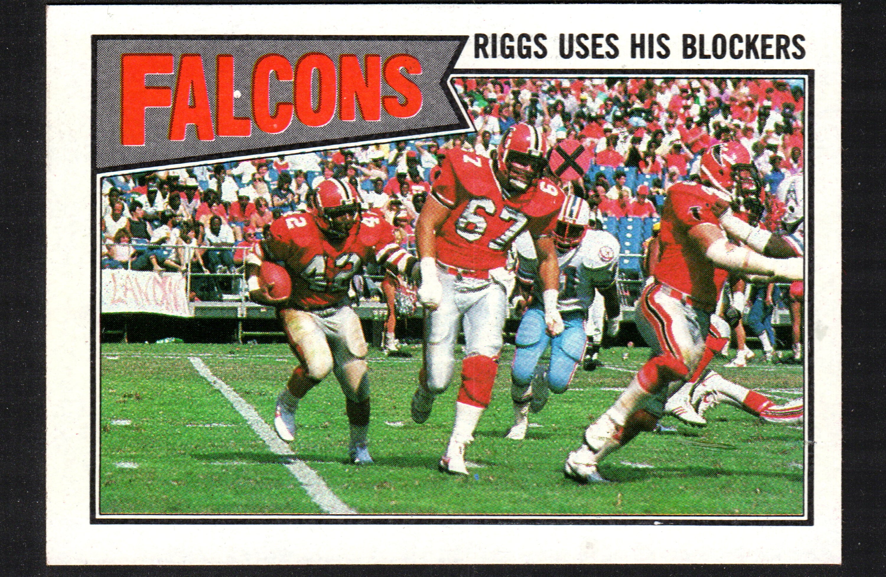 1987 Topps trading card of Gerald Riggs, Atlanta Falcons, showcasing him using blockers during a game.