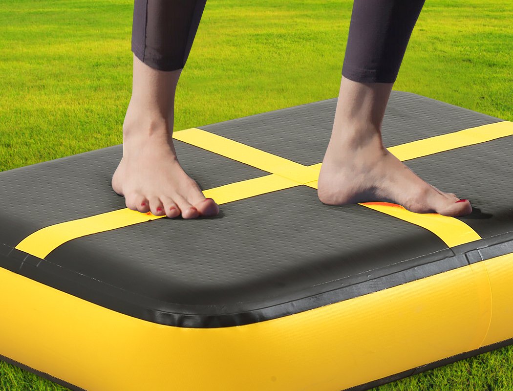 0.6M X1M inflatable air track mat in yellow and black, designed for gymnastics and cheerleading training.