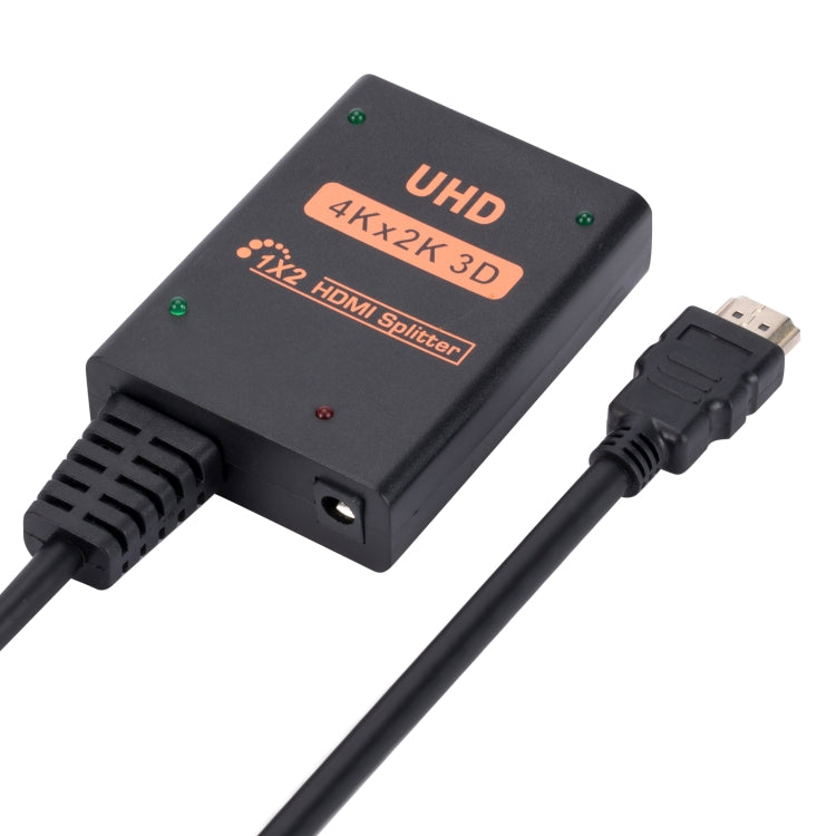 1 into 2 out HDMI 4K HD Video Splitter with power supply cord, showcasing its compact design and ports.