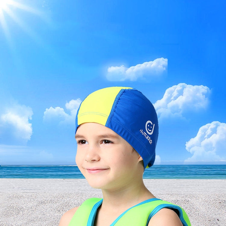 A vibrant children's swimming cap made of cotton and spandex, designed for sun protection and comfort, featuring a snug fit and anti-fog coating.