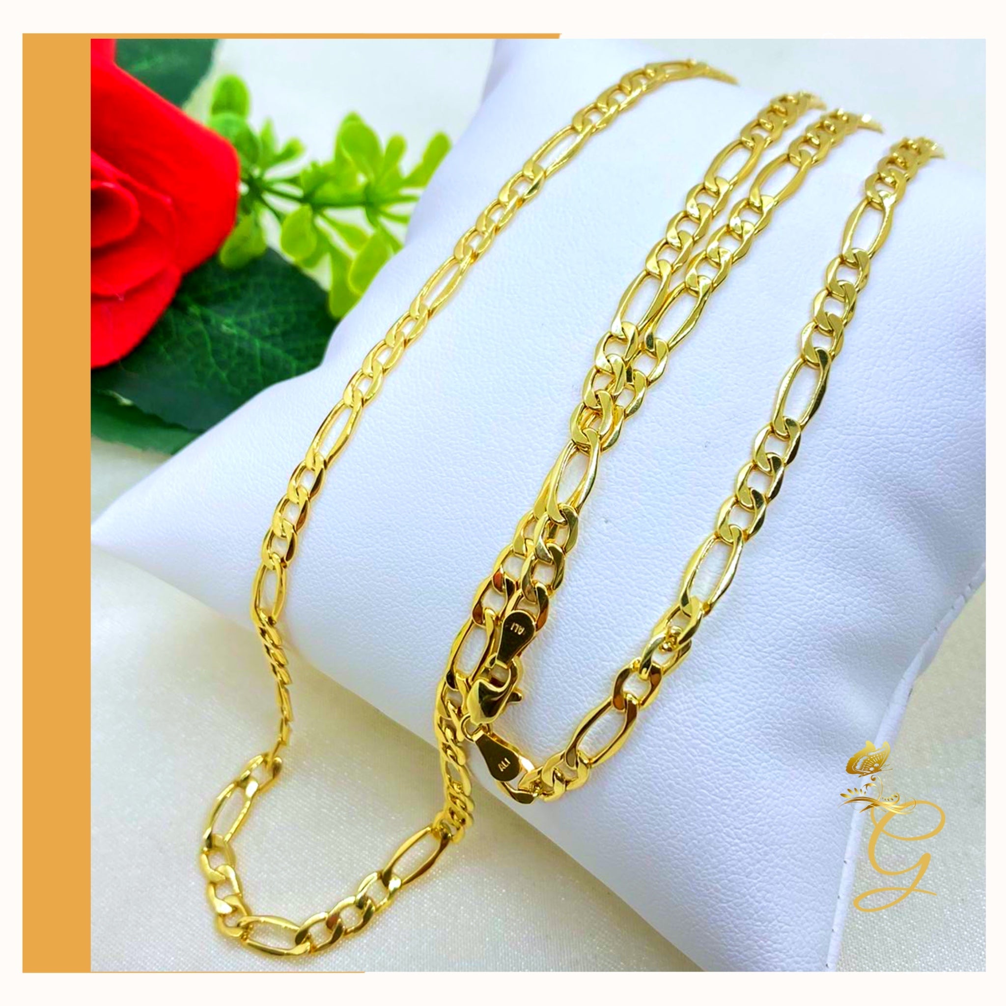 A 10K gold solid Figaro chain for men, 24 inches long and 4.98MM wide, showcasing its elegant design and yellow gold color.