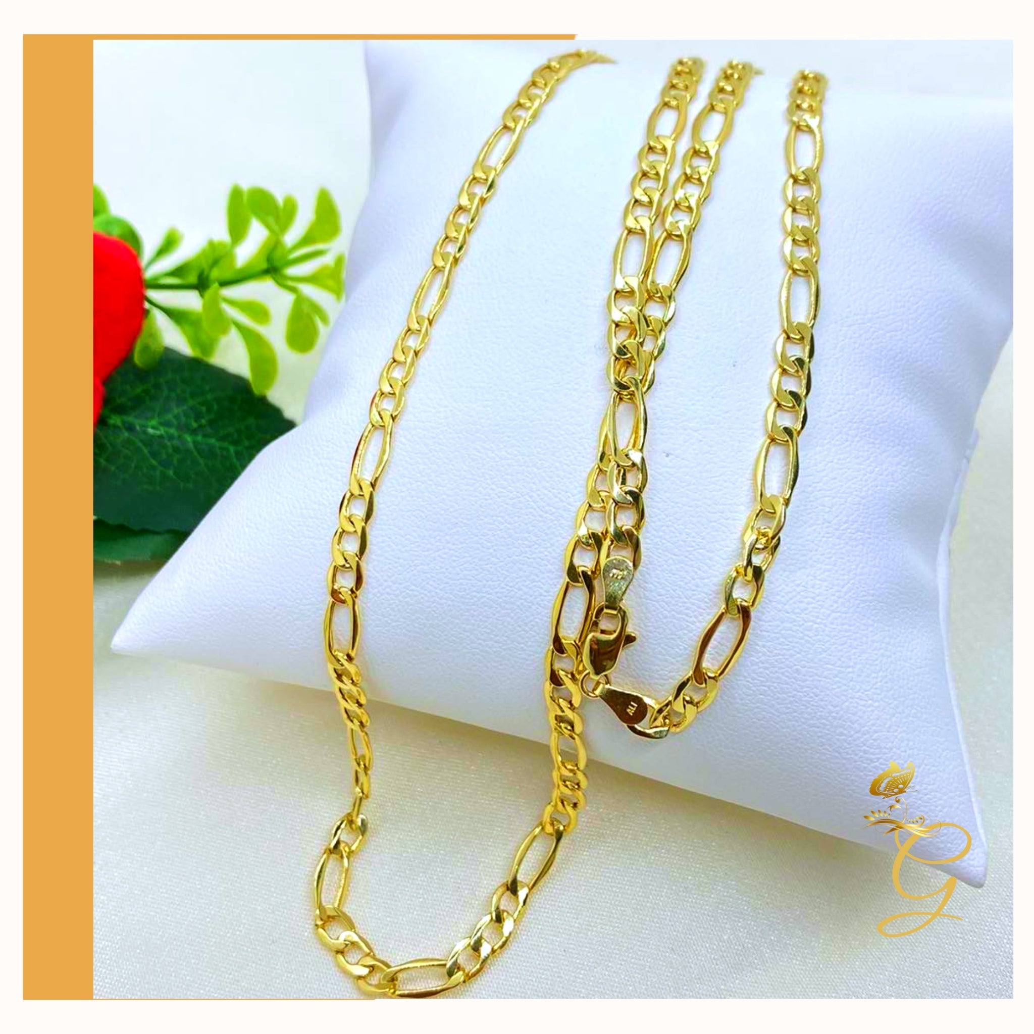 A 10K gold solid Figaro chain for men, 24 inches long and 4.98MM wide, showcasing its elegant design and yellow gold color.