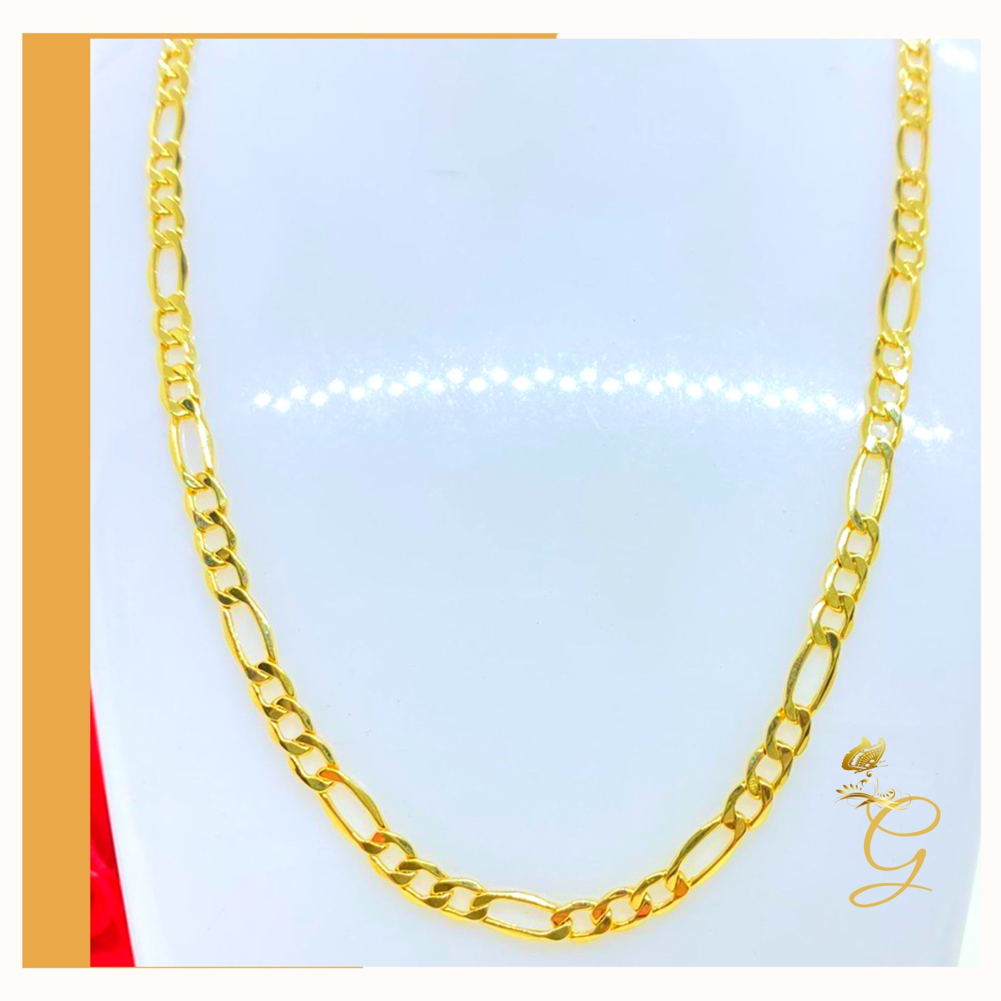 A 10K gold solid Figaro chain for men, 24 inches long and 4.98MM wide, showcasing its elegant design and yellow gold color.