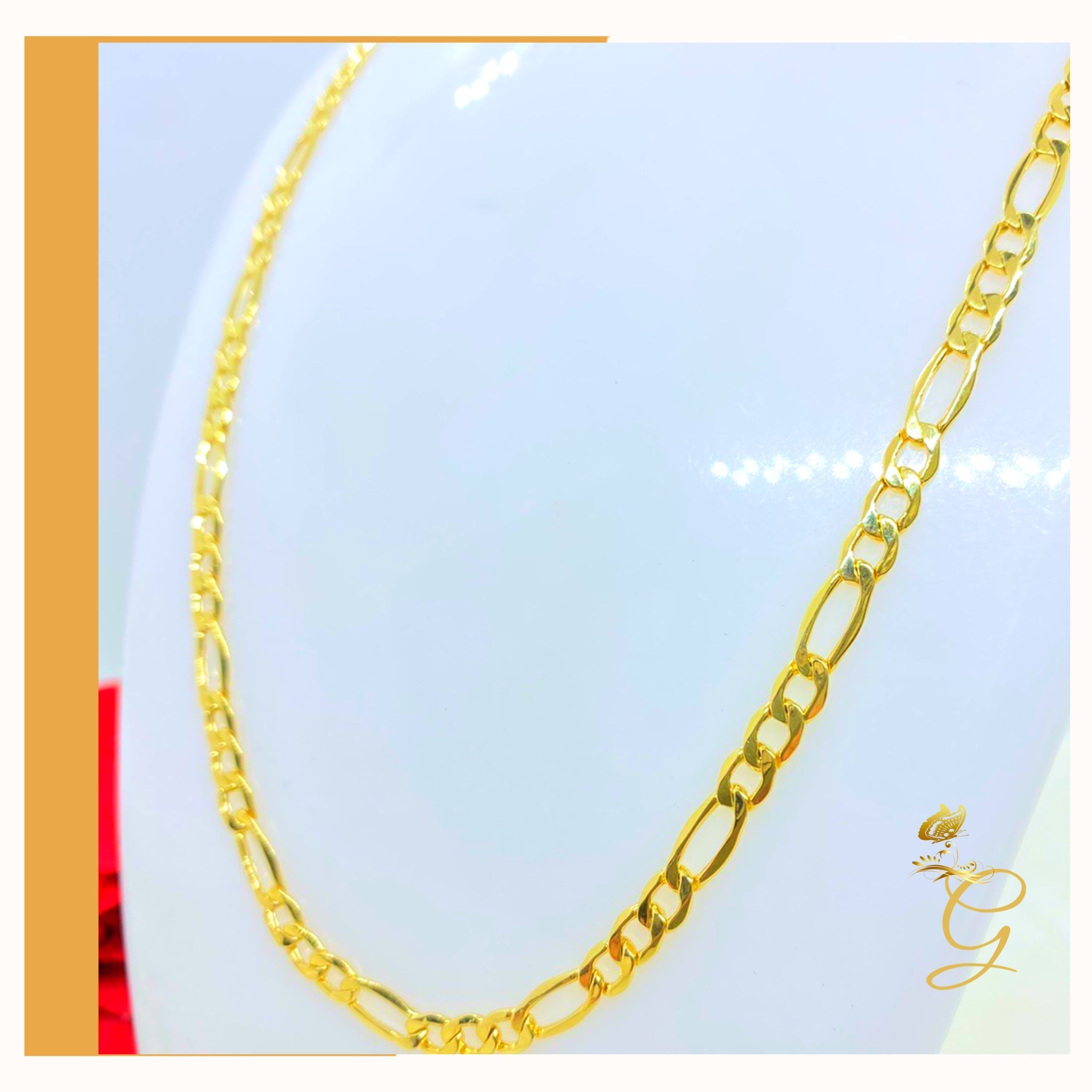 A 10K gold solid Figaro chain for men, 24 inches long and 4.98MM wide, showcasing its elegant design and yellow gold color.