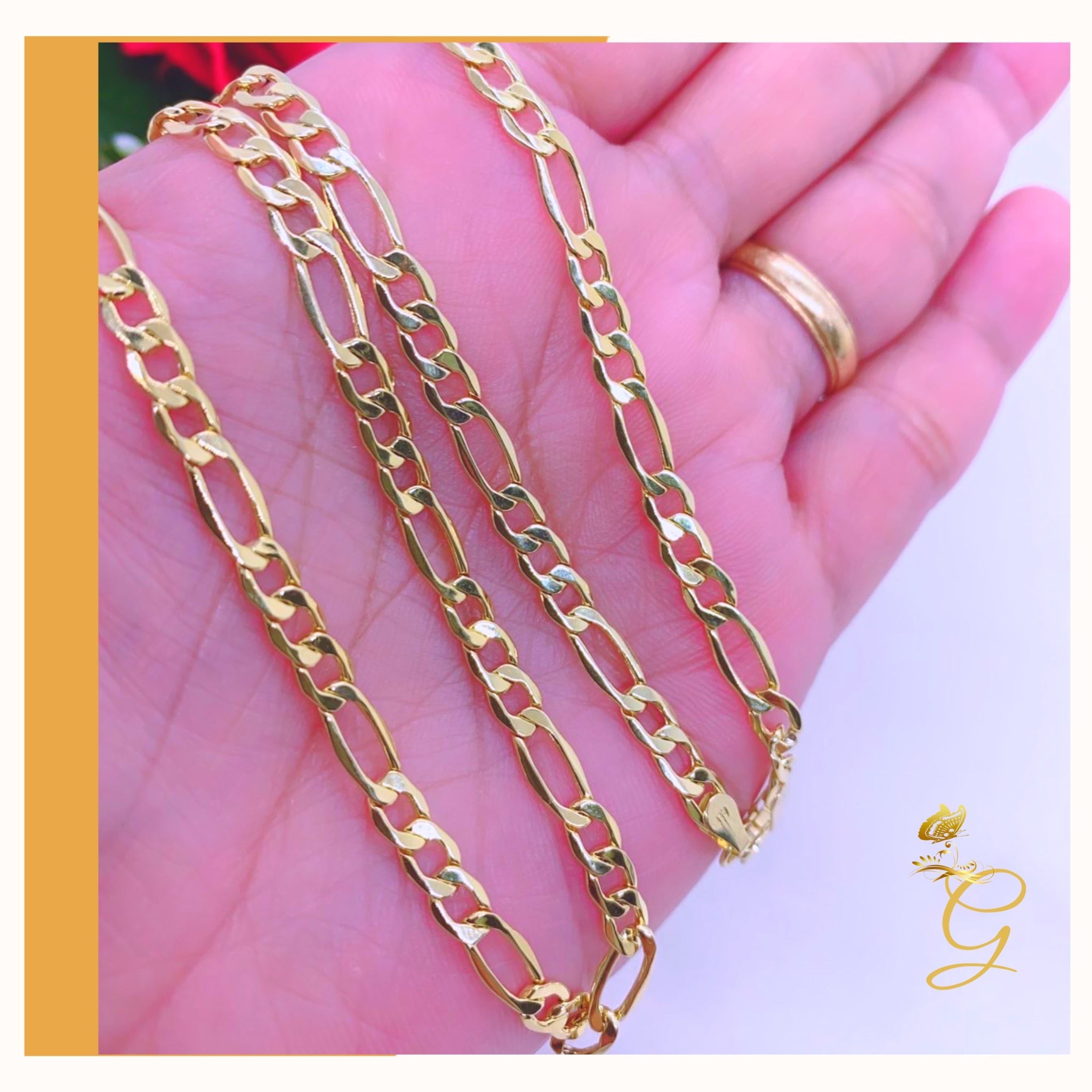 A 10K gold solid Figaro chain for men, 24 inches long and 4.98MM wide, showcasing its elegant design and yellow gold color.