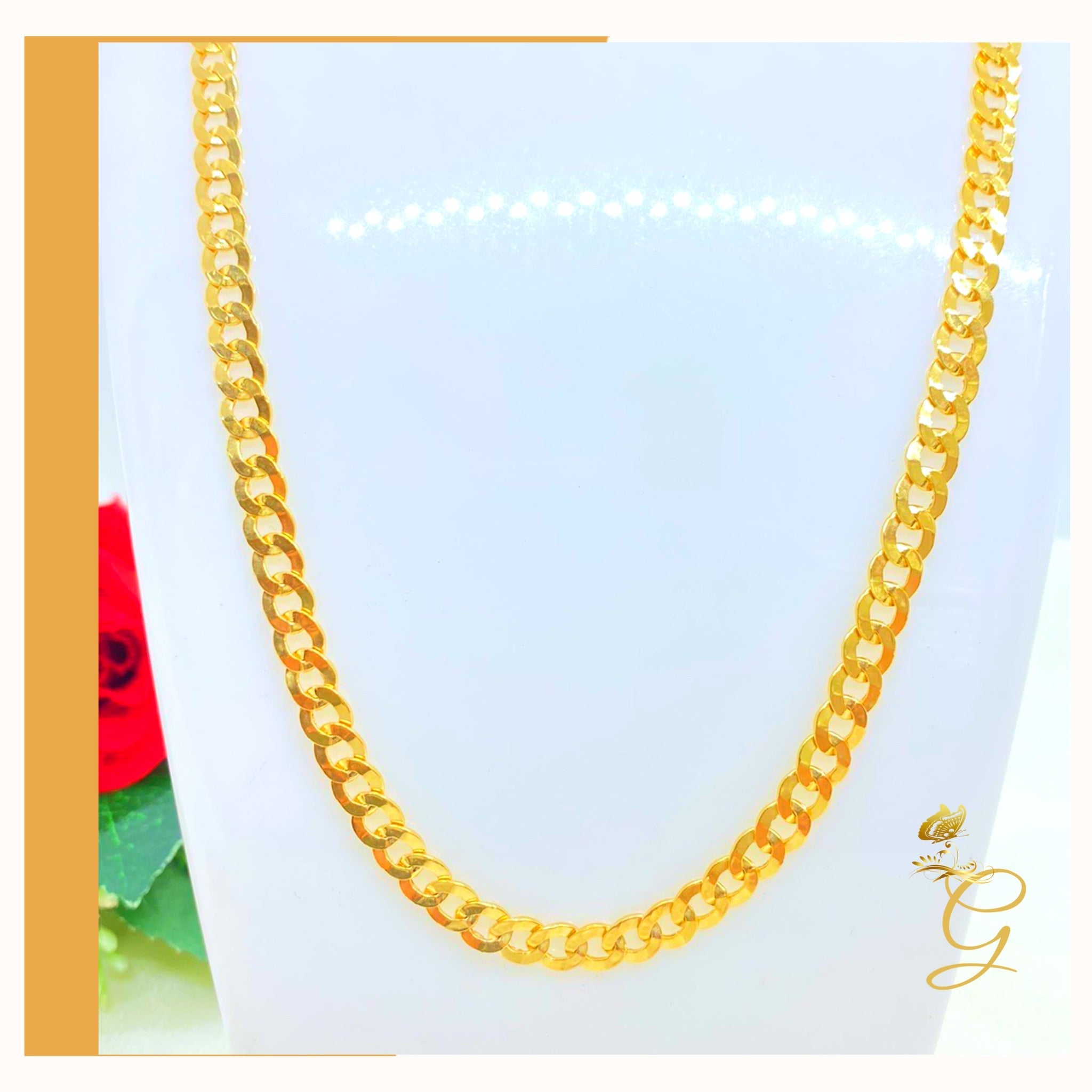 A 10K Gold Cuban Link Chain, 24 inches long with a 5.53MM width, showcasing its solid yellow gold design.