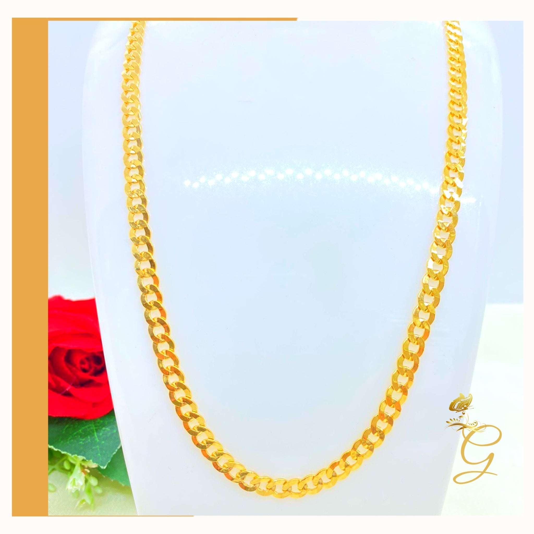 A 10K Gold Cuban Link Chain, 24 inches long with a 5.53MM width, showcasing its solid yellow gold design.