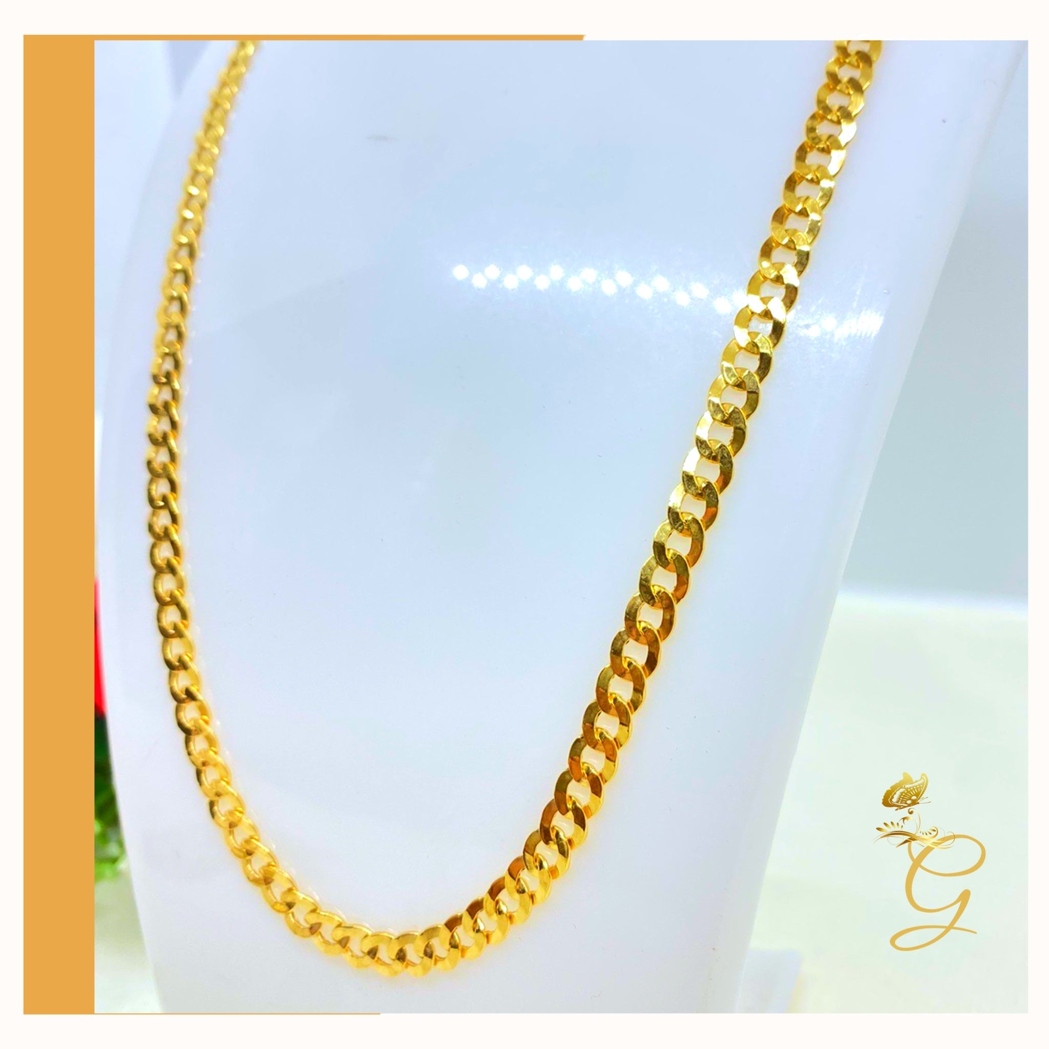 A 10K Gold Cuban Link Chain, 24 inches long with a 5.53MM width, showcasing its solid yellow gold design.