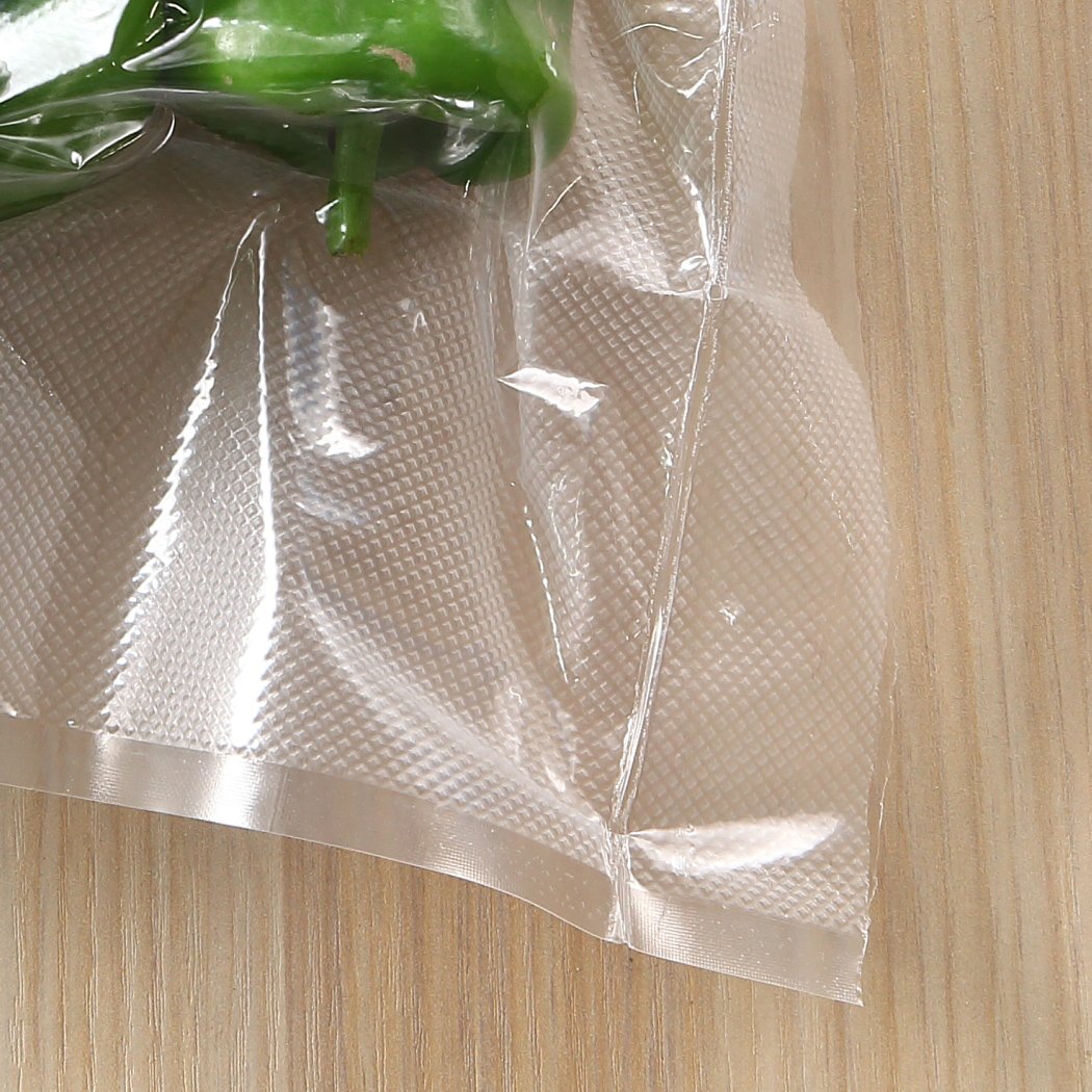 100x Commercial Grade Vacuum Sealer Bags, heavy-duty, BPA-free, suitable for freezing and microwaving, with clear front and embossed back.