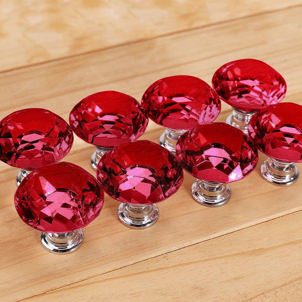 A set of 16 red crystal knobs with a diamond shape, perfect for cabinet and drawer handles, showcasing their brilliant shine and elegant design.