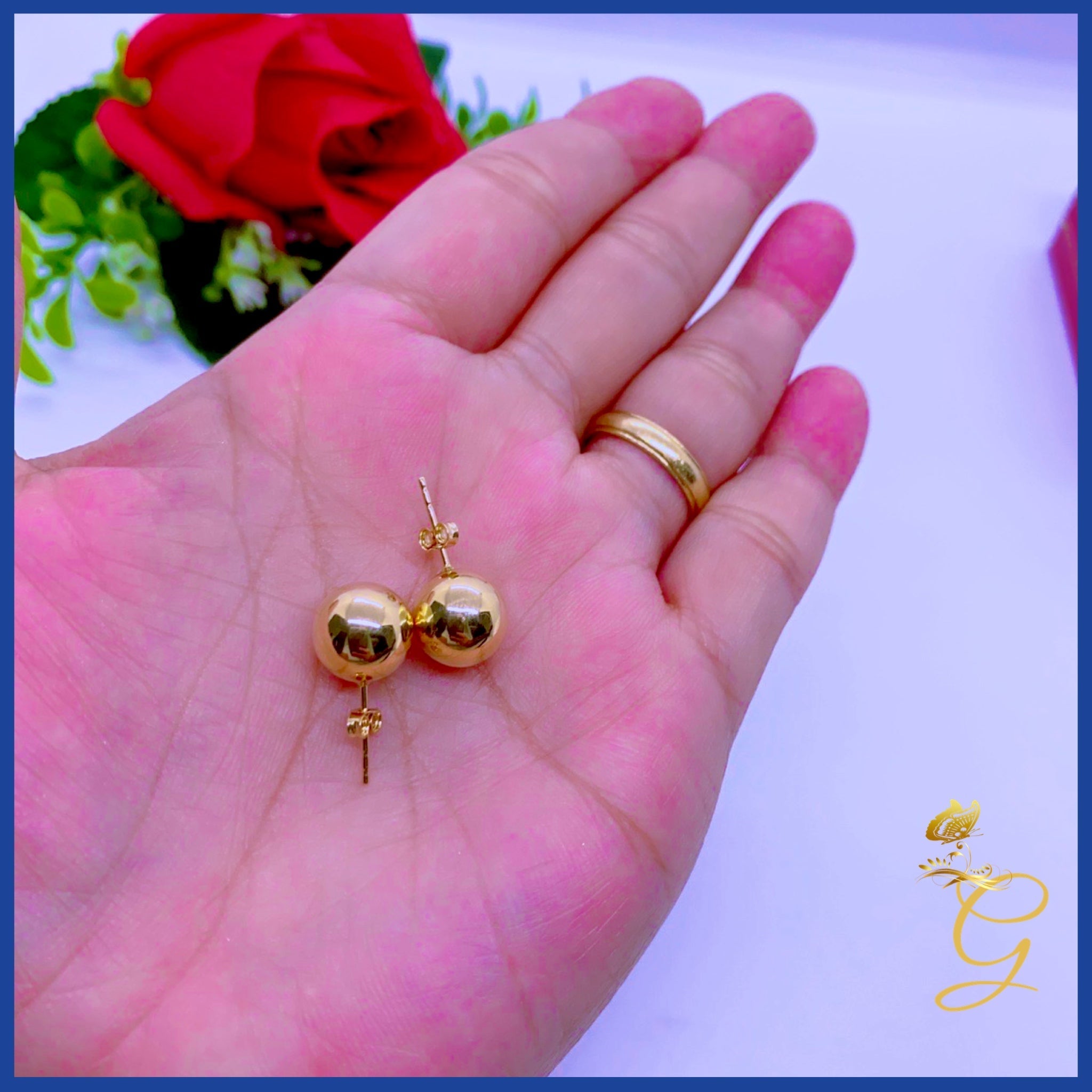 Elegant 18K Real Gold Ball Stud Earrings showcasing their shiny yellow gold finish and classic design.