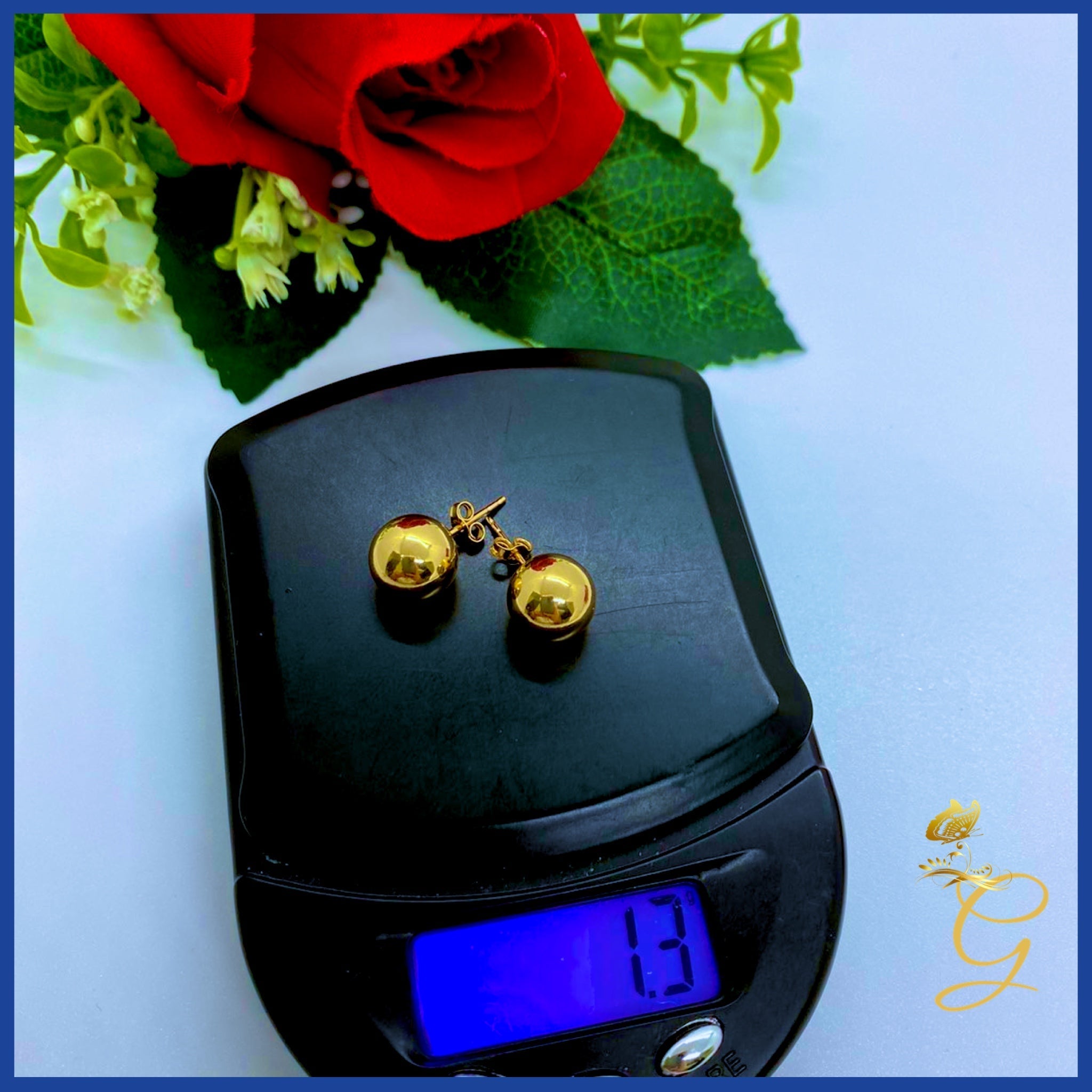 Elegant 18K Real Gold Ball Stud Earrings showcasing their shiny yellow gold finish and classic design.