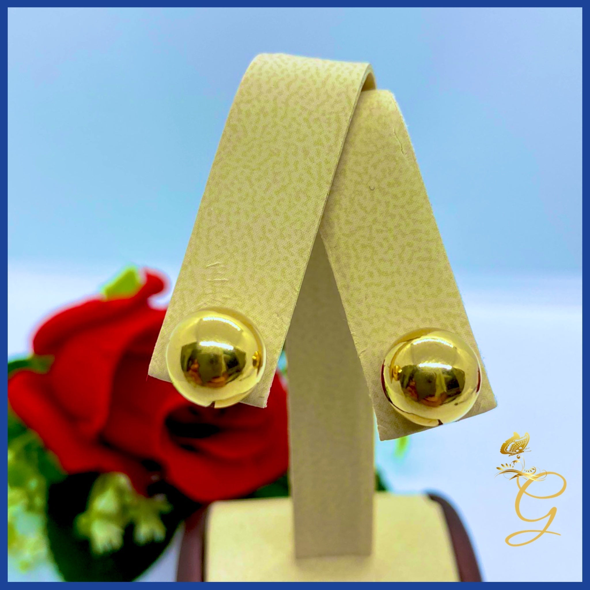 Elegant 18K Real Gold Ball Stud Earrings showcasing their shiny yellow gold finish and classic design.