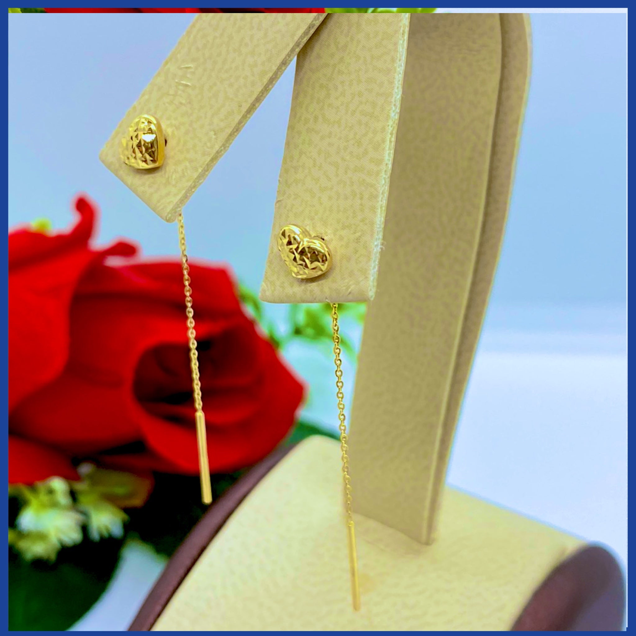 Elegant 18K real gold heart drop earrings, showcasing a stylish design with a rich yellow gold finish.