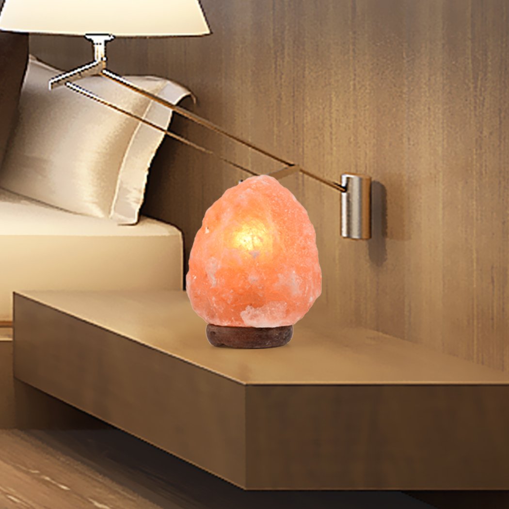 Two Himalayan salt lamps with natural light dimmers, showcasing their warm glow and natural rock crystal texture.