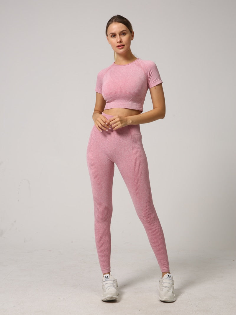 A stylish 2 PCS Seamless Yoga Set for women, featuring a short sleeve crop top and high waist leggings in vibrant colors.