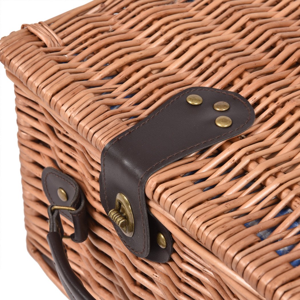 A stylish 2 person picnic basket set made of willow, featuring insulated storage, PU leather straps, and a matching blanket for outdoor dining.