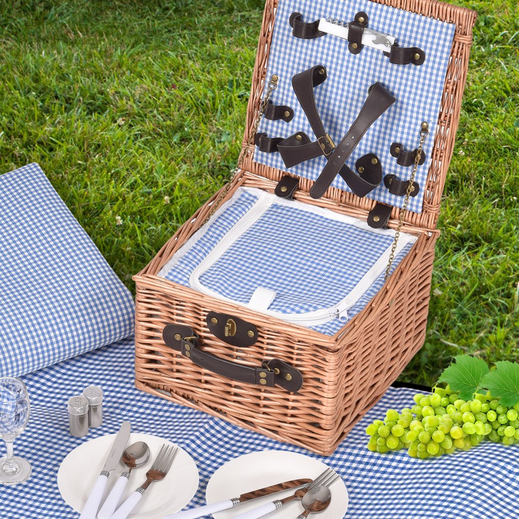 A stylish 2 person picnic basket set made of willow, featuring insulated storage, PU leather straps, and a matching blanket for outdoor dining.