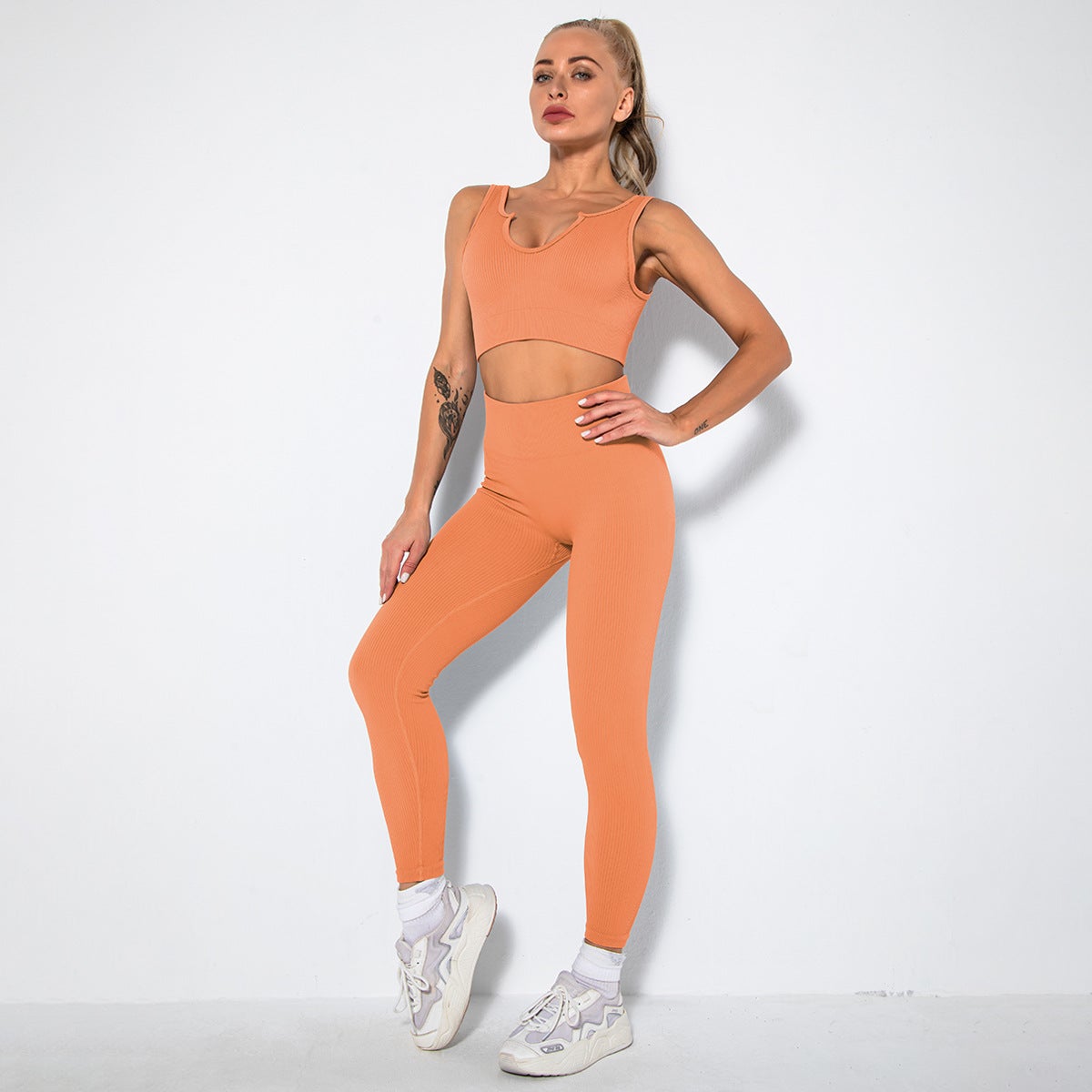 A stylish 2 pieces seamless yoga set for women, featuring high waist leggings and a matching sports bra in various colors.