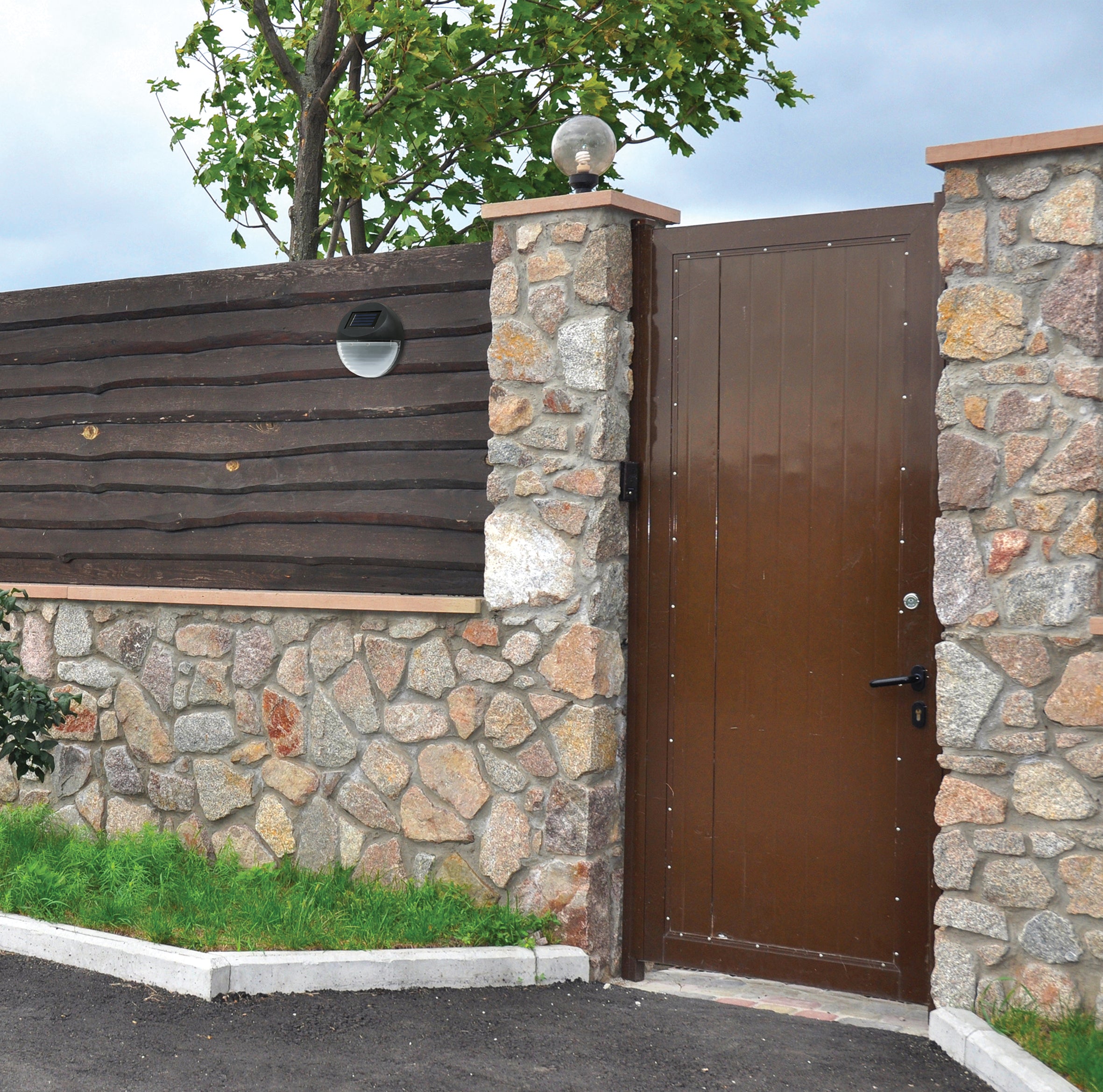 Two round solar-powered LED fence lights designed for outdoor use, showcasing a waterproof and durable construction in black color.