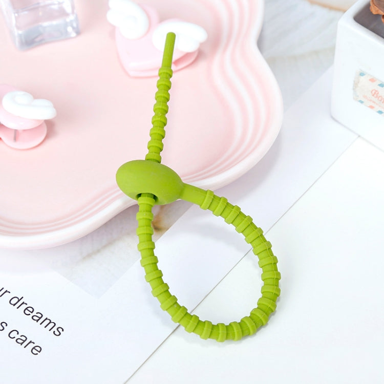 20 PCS green silicone cable storage straps neatly arranged, showcasing their flexibility and self-locking buckle design.