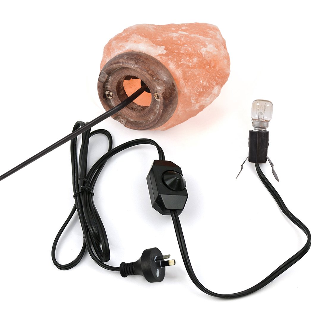 A 2-3 kg Himalayan salt lamp with a natural light dimmer switch, showcasing its warm glow and unique crystal texture.