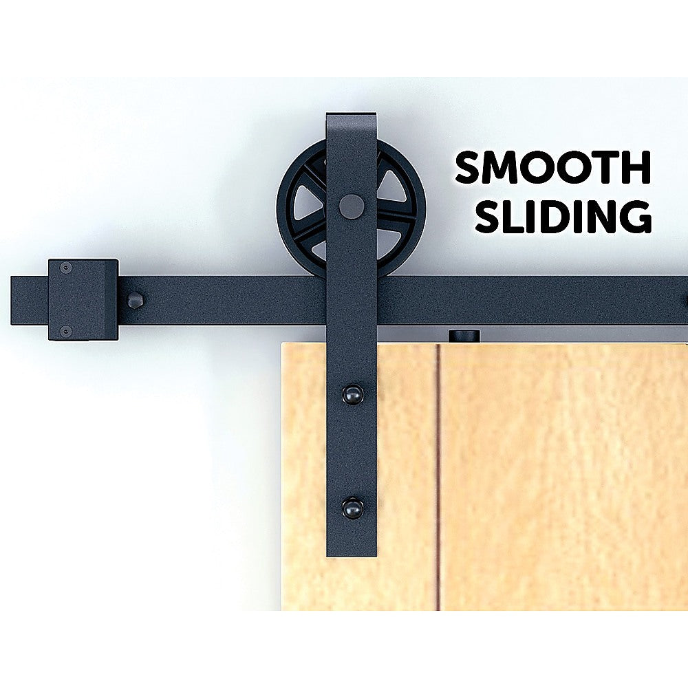 2M Big Spoke Wheel Sliding Barn Door Hardware set featuring a stylish black finish and robust carbon steel construction.