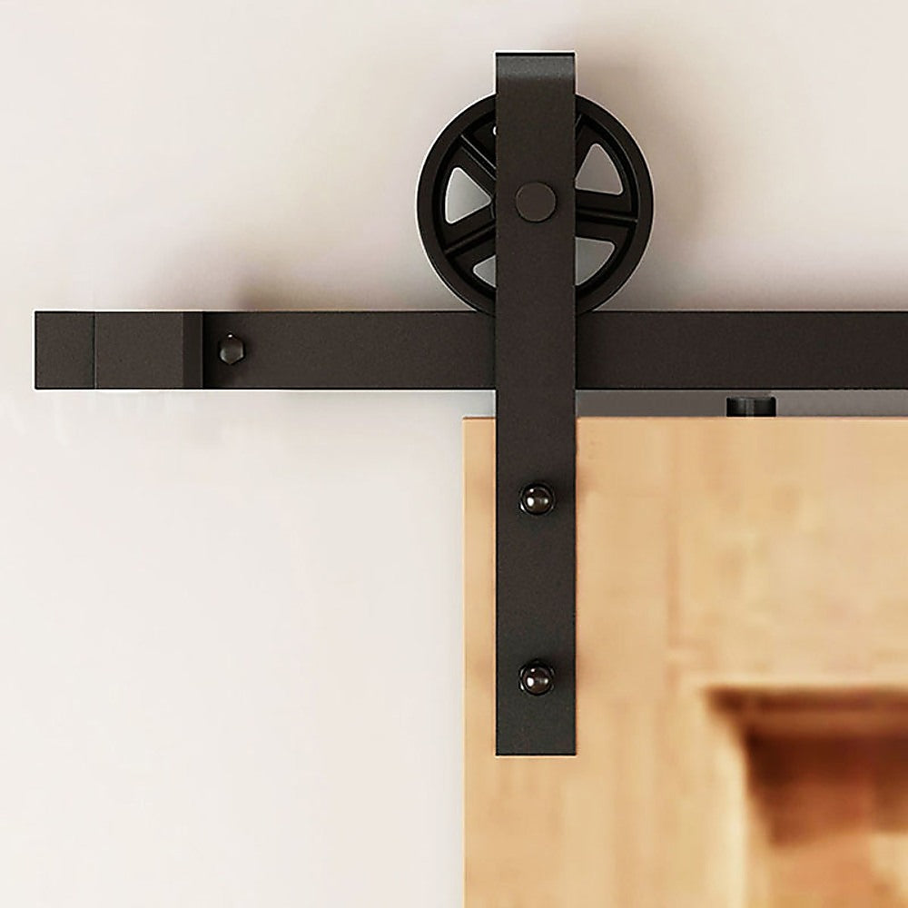 2M Big Spoke Wheel Sliding Barn Door Hardware set featuring a stylish black finish and robust carbon steel construction.