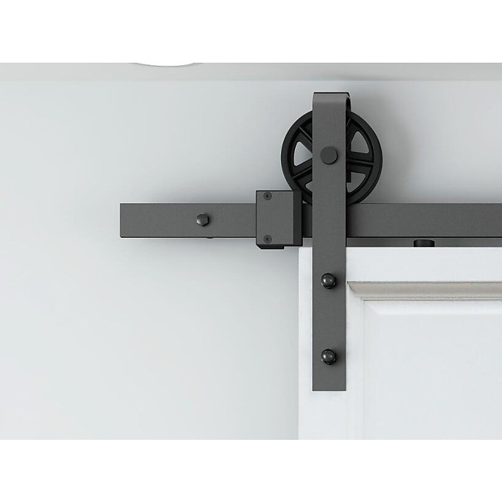 2M Big Spoke Wheel Sliding Barn Door Hardware set featuring a stylish black finish and robust carbon steel construction.