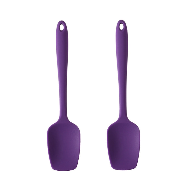 Two purple silicone square cake scrapers with rounded handles, ideal for baking and food preparation.