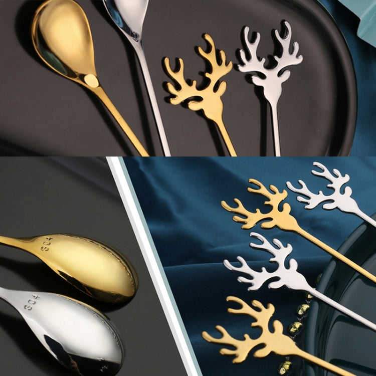 Two Christmas-themed stainless steel stirring spoons with deer design, perfect for holiday beverages.